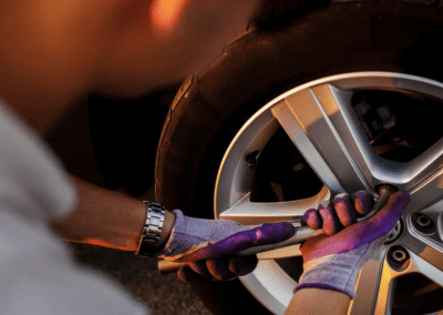 Man fixing the wheel bolts